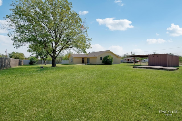 view of yard with a carport