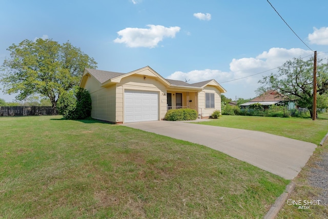 view of front of house featuring a front lawn and a garage