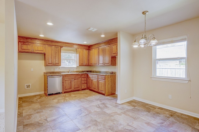 kitchen featuring an inviting chandelier, stainless steel dishwasher, pendant lighting, and sink