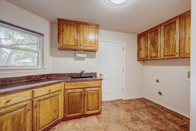 kitchen with sink and a textured ceiling