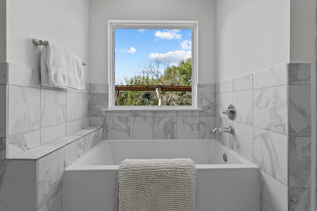 bathroom featuring a tub to relax in