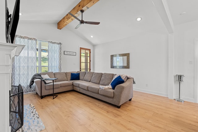 living room with lofted ceiling with beams, light hardwood / wood-style floors, and ceiling fan