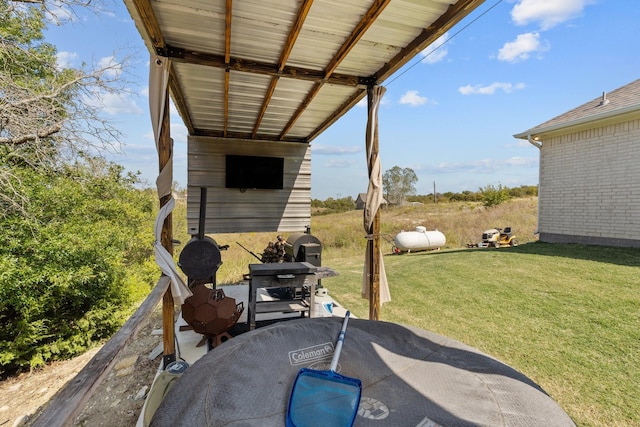 view of patio featuring a grill