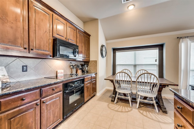 kitchen featuring tasteful backsplash, light tile patterned floors, dark stone counters, ornamental molding, and black appliances