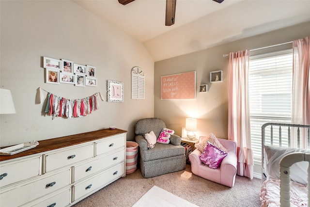 carpeted bedroom featuring lofted ceiling and ceiling fan