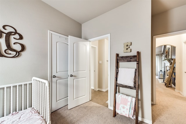 bedroom with light colored carpet