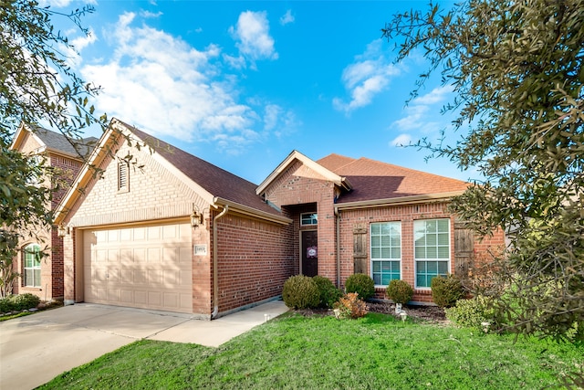 view of front of property with a front lawn and a garage