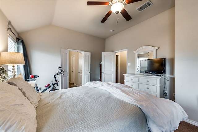 carpeted bedroom with vaulted ceiling and ceiling fan