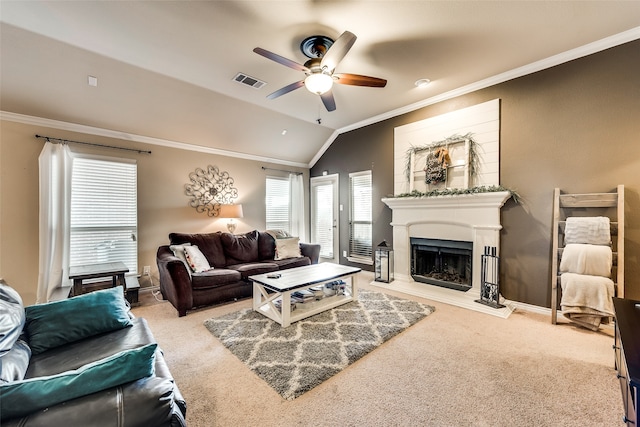 carpeted living room featuring lofted ceiling, crown molding, and ceiling fan