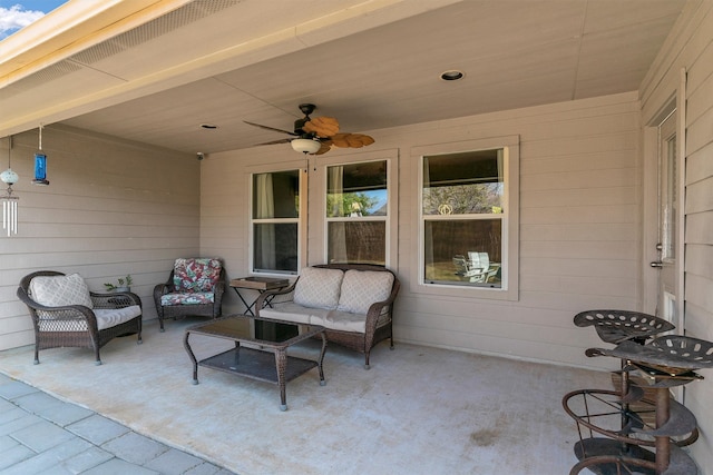 view of patio with outdoor lounge area and ceiling fan