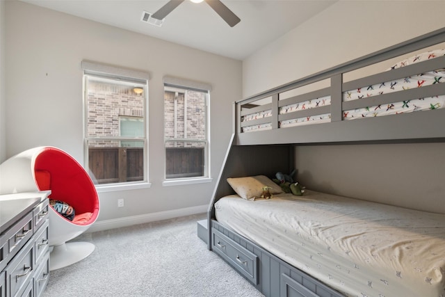 bedroom with light carpet and ceiling fan