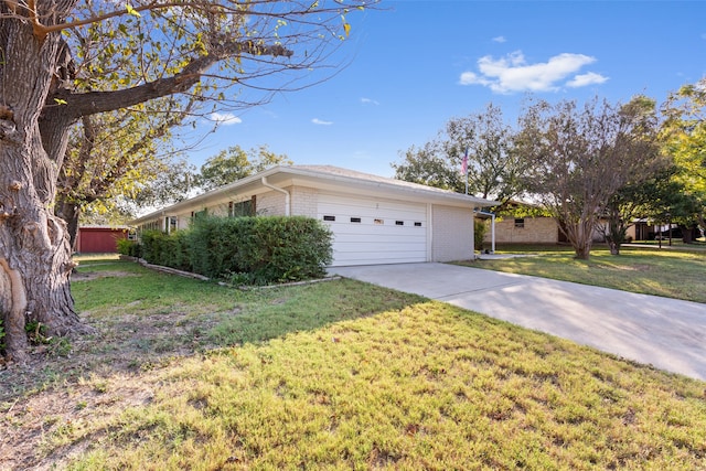 single story home featuring a front lawn and a garage