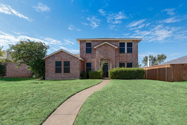 front facade featuring a front yard