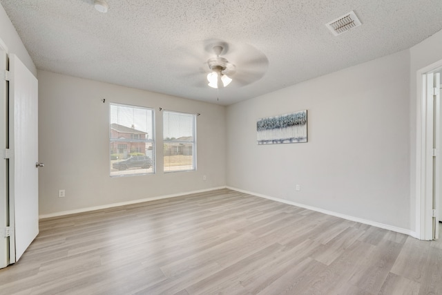 unfurnished bedroom featuring light hardwood / wood-style flooring, a textured ceiling, and ceiling fan