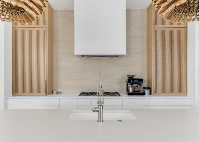 kitchen with sink and stainless steel gas stovetop