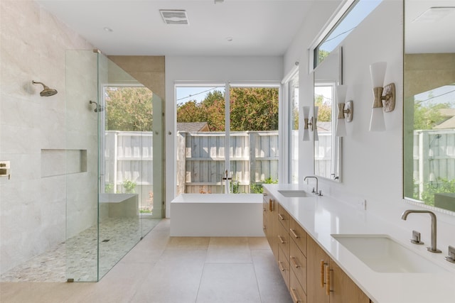 bathroom with vanity, separate shower and tub, tile patterned flooring, and plenty of natural light