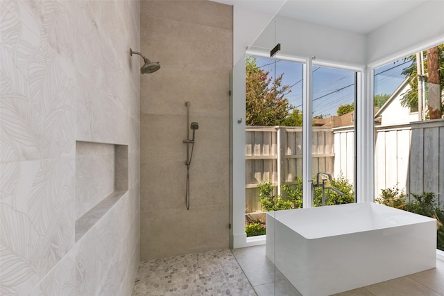 bathroom featuring separate shower and tub and tile patterned flooring