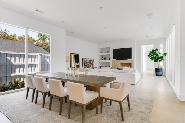 tiled dining space with built in shelves