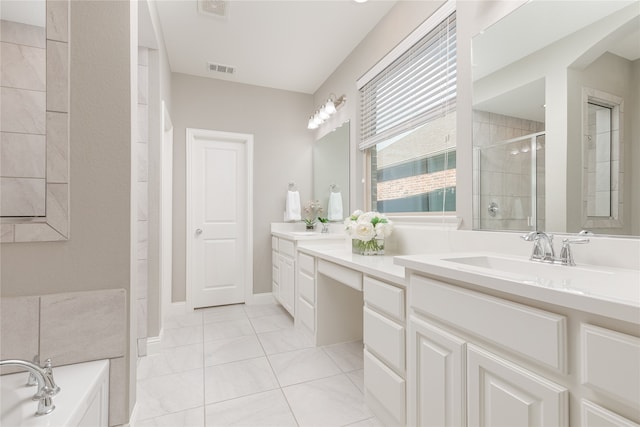 bathroom with vanity, tile patterned floors, and shower with separate bathtub