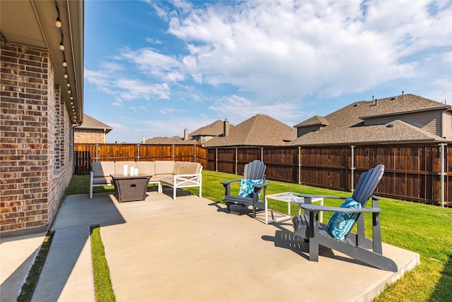 view of patio / terrace with an outdoor living space with a fire pit