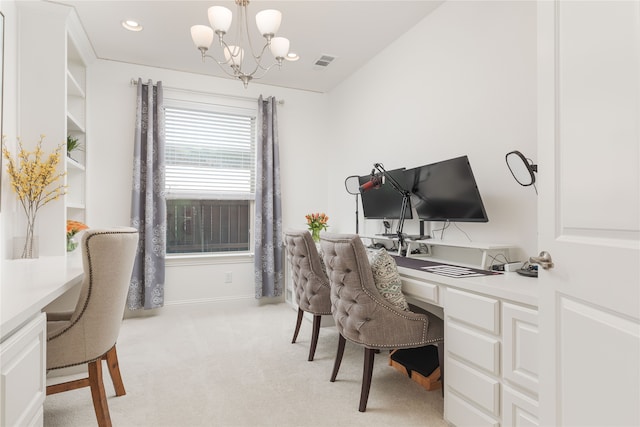 carpeted office featuring built in desk and a chandelier