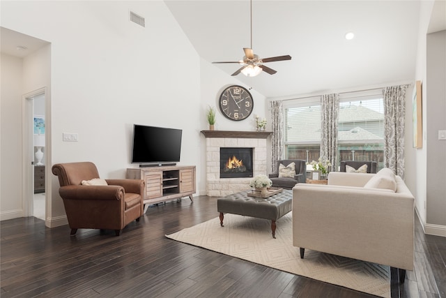 living room featuring a fireplace, high vaulted ceiling, and dark hardwood / wood-style flooring