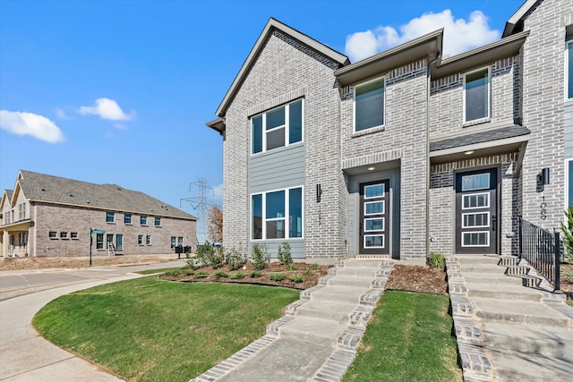 view of front of home with a front lawn