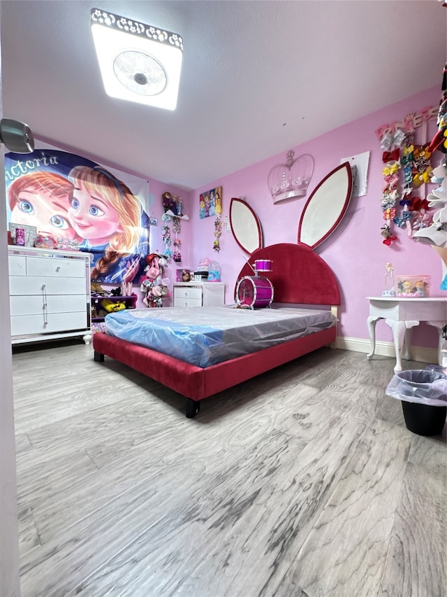 bedroom with hardwood / wood-style flooring