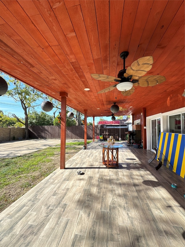 wooden deck featuring a patio and ceiling fan