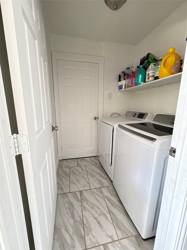 washroom featuring washing machine and dryer