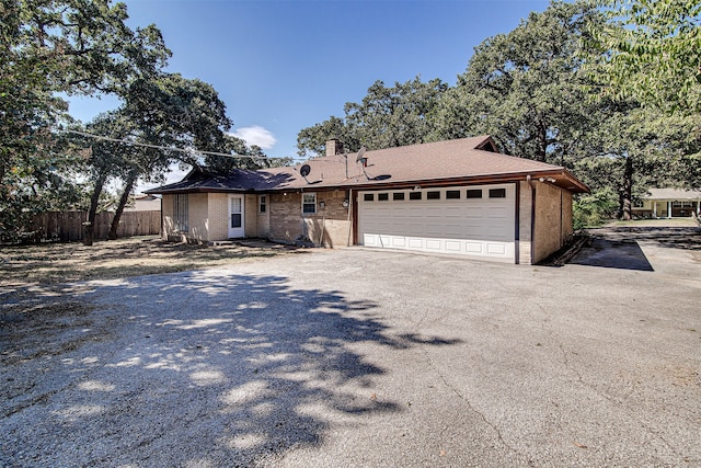 single story home featuring a garage