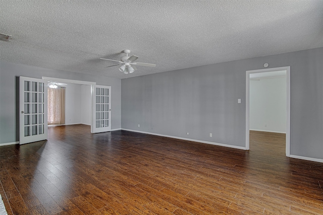 spare room featuring dark wood-type flooring, a textured ceiling, french doors, and ceiling fan