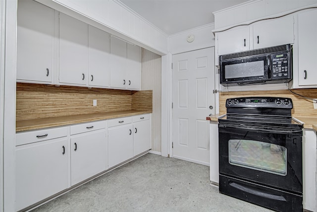 kitchen featuring white cabinetry, tasteful backsplash, and black appliances