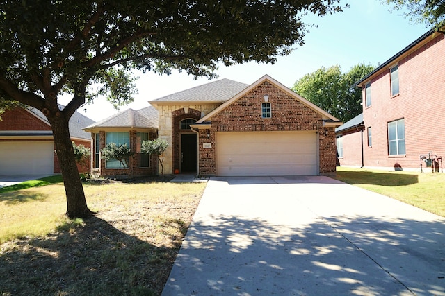 front of property featuring a garage and a front lawn