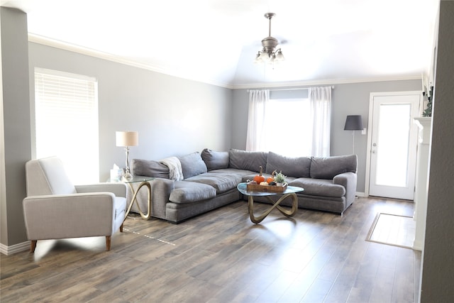 living room featuring ornamental molding, dark wood-type flooring, and ceiling fan