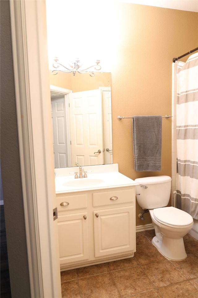 bathroom with vanity, toilet, tile patterned flooring, and a shower with shower curtain