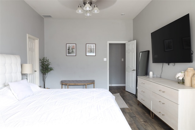 bedroom with ceiling fan and dark hardwood / wood-style flooring