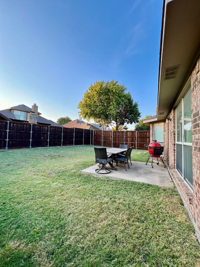 view of yard with a patio area