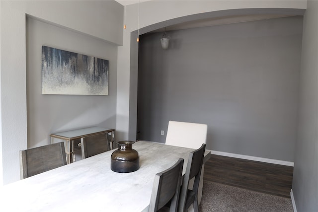 dining space featuring dark hardwood / wood-style flooring