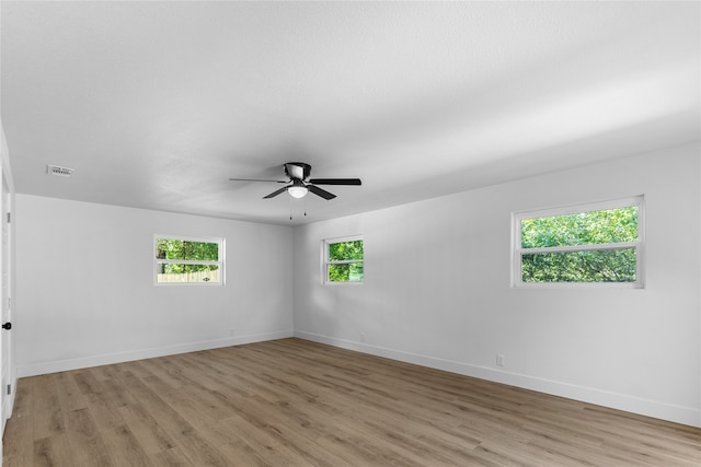 unfurnished room with light hardwood / wood-style floors and ceiling fan