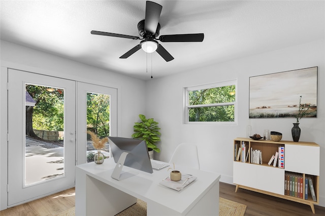 home office with ceiling fan, wood-type flooring, and plenty of natural light