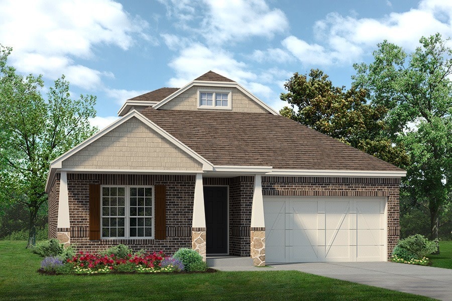 view of front facade with a front yard and a garage