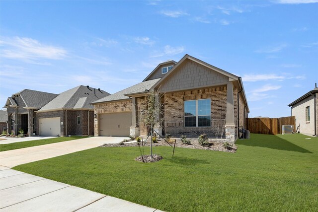 view of front of property with a front yard, brick siding, an attached garage, and driveway