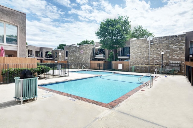 view of pool featuring a patio