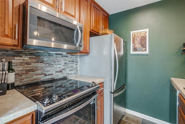 kitchen with backsplash and black electric range