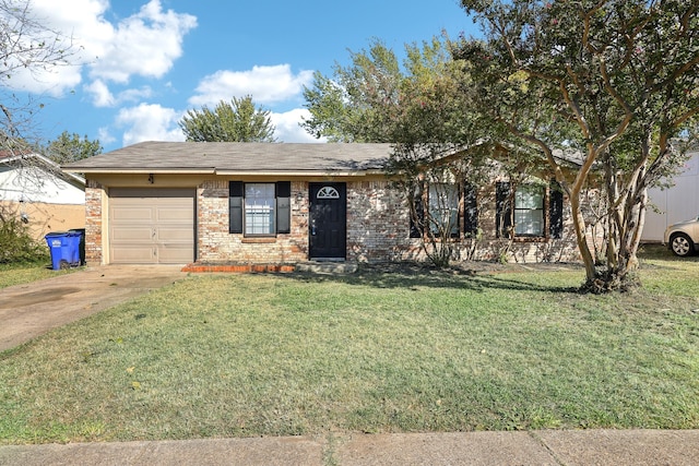 ranch-style home featuring a garage and a front yard