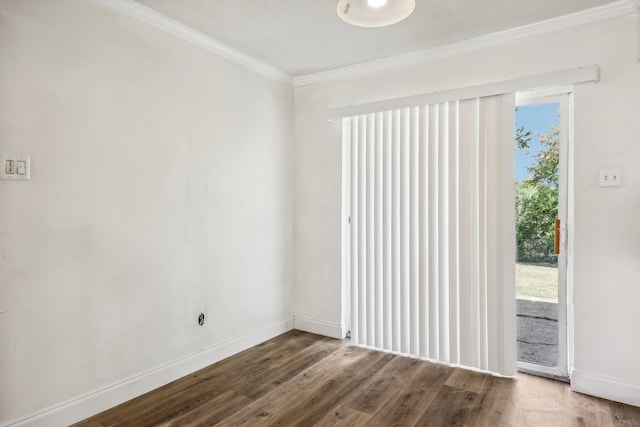 spare room with hardwood / wood-style flooring and ornamental molding