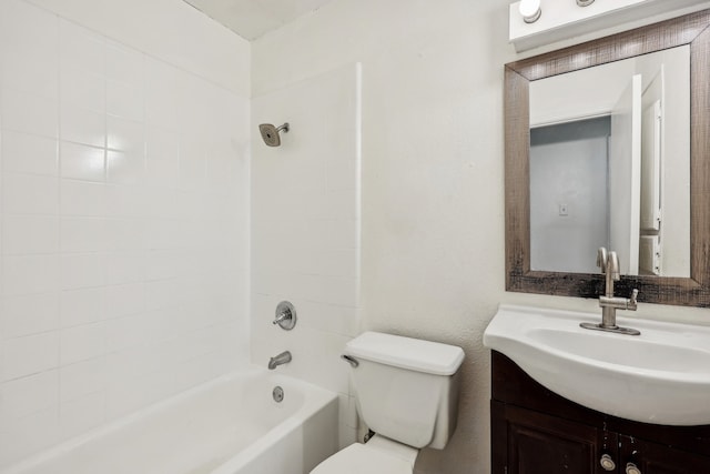 full bathroom with vanity, toilet, and tiled shower / bath combo