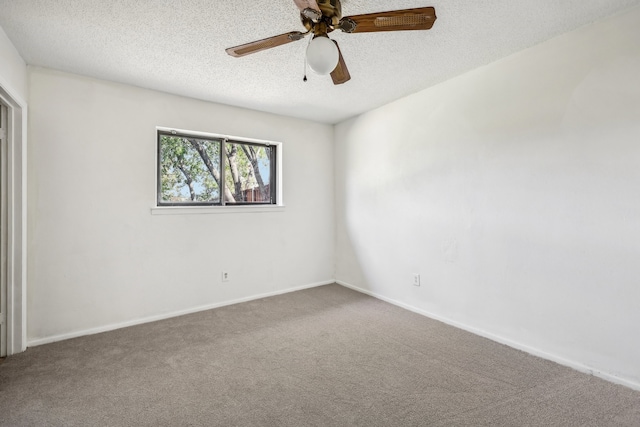 empty room with carpet flooring, a textured ceiling, and ceiling fan