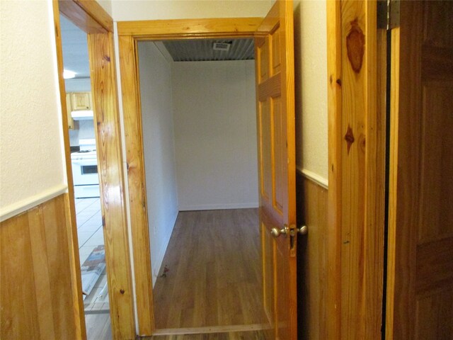 hallway featuring hardwood / wood-style flooring